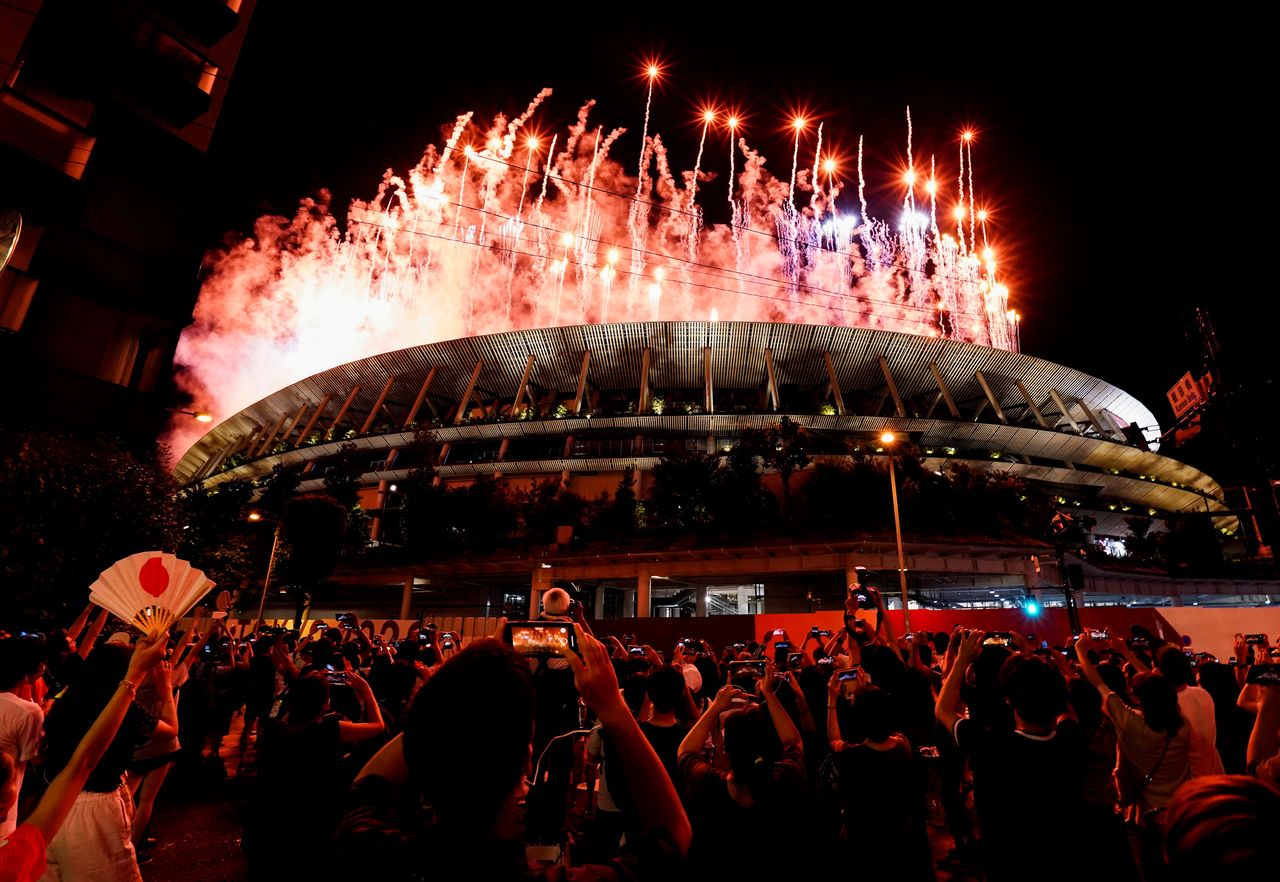 FILE PHOTO: Tokyo 2020 Olympics - The Tokyo 2020 Olympics Opening Ceremony - Olympic Stadium, Tokyo, Japan - July 23, 2021. Fireworks are seen from outside the stadium during the Opening Ceremony. REUTERS/Naoki Ogura