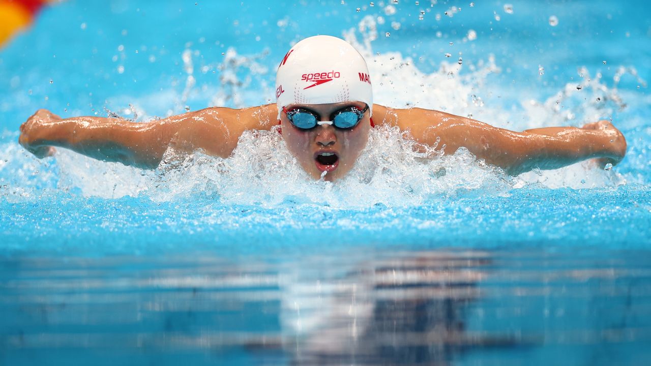 Tokyo 2020 Olympics - Swimming - Women's 100m Butterfly - Heats - Tokyo Aquatics Centre - Tokyo, Japan - July 24, 2021. Maggie MacNeil of Canada in action REUTERS/Kai Pfaffenbach