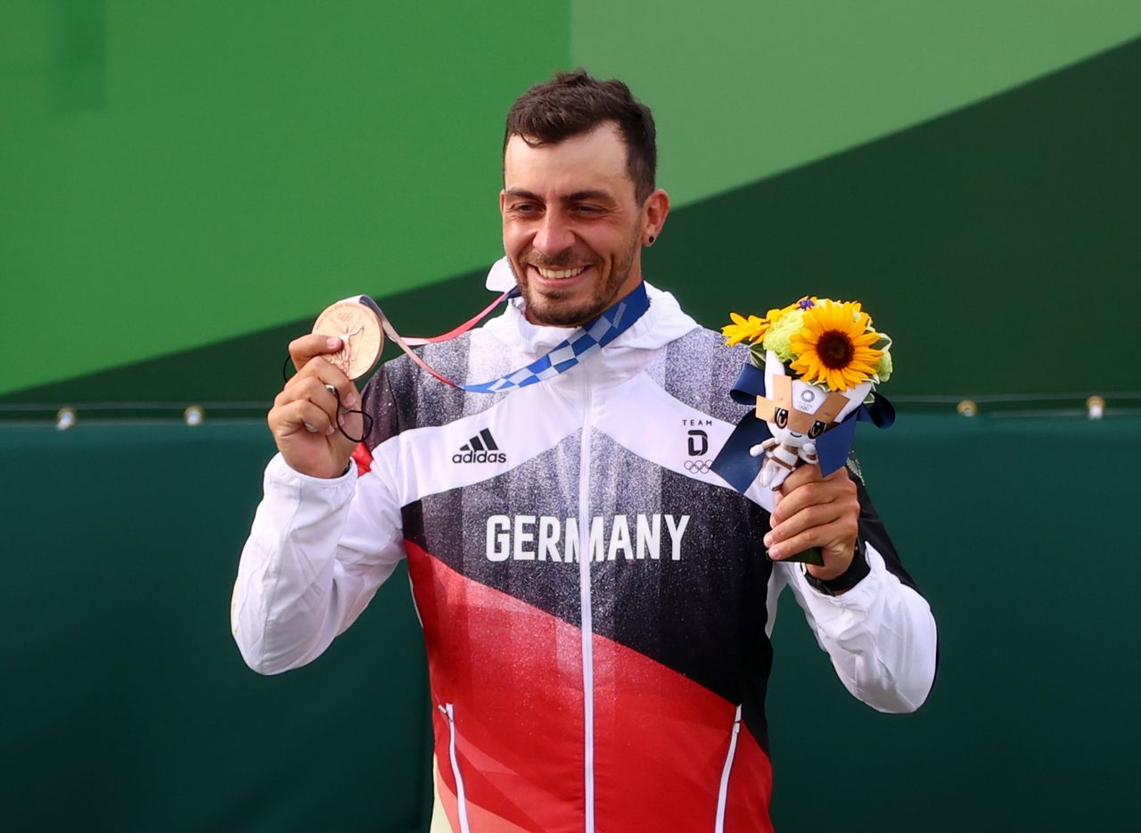 Tokyo 2020 Olympics - Canoe Slalom - Men's C1 - Medal Ceremony - Kasai Canoe Slalom Centre, Tokyo, Japan - July 26, 2021. Gold medallist Benjamin Savsek of Slovenia celebrates on the podium with his medal REUTERS/Stoyan Nenov