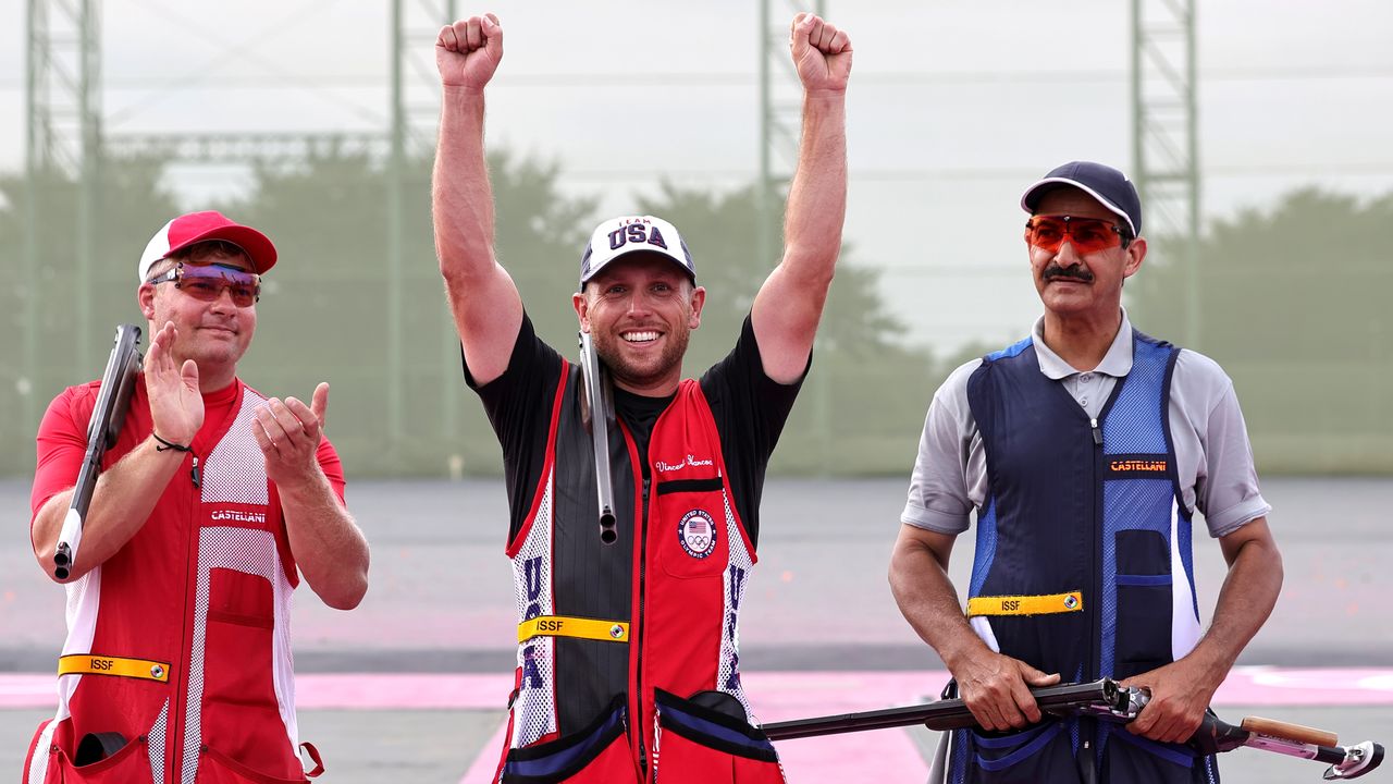 Tokyo 2020 Olympics - Shooting - Men's Skeet - Final - Asaka Shooting Range, Tokyo, Japan - July 26, 2021. Gold medalist Vincent Hancock of the United States celebrates with silver medalist Jesper Hansen of Denmark and bronze medalist Abdullah Alrashidi of Kuwait REUTERS/Ann Wang
