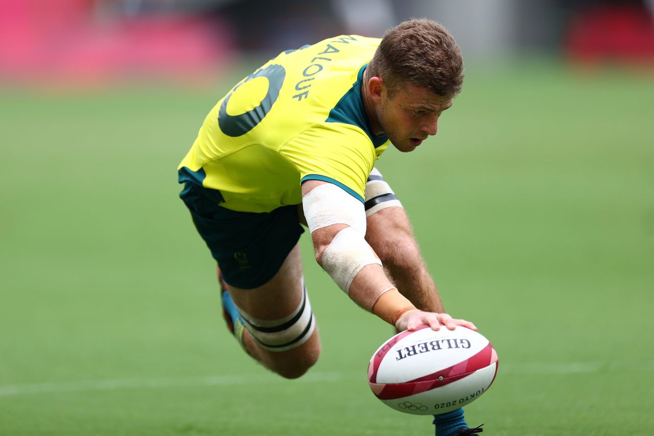 Tokyo 2020 Olympics - Rugby Sevens - Men - Pool A - New Zealand v Australia - Tokyo Stadium - Tokyo, Japan - July 27, 2021. Nick Malouf of Australia scores a try. REUTERS/Siphiwe Sibeko