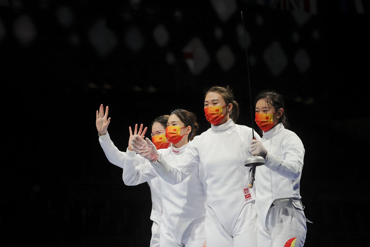 Tokyo 2020 Olympics - Fencing - Women's Team Epee - Quarterfinal - Makuhari Messe Hall B - Chiba, Japan - July 27, 2021. Sun Yiwen of China, Lin Sheng of China, Xu Anqi of China and Zhu Mingye of China celebrate after competing REUTERS/Maxim Shemetov