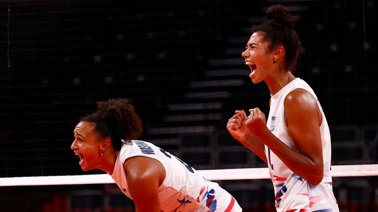 Tokyo 2020 Olympics - Volleyball - Women's Pool B - China v United States - Ariake Arena, Tokyo, Japan – July 27, 2021. Jordan Thompson of the United States and Haleigh Washington of the United States celebrate. REUTERS/Carlos Garcia Rawlins