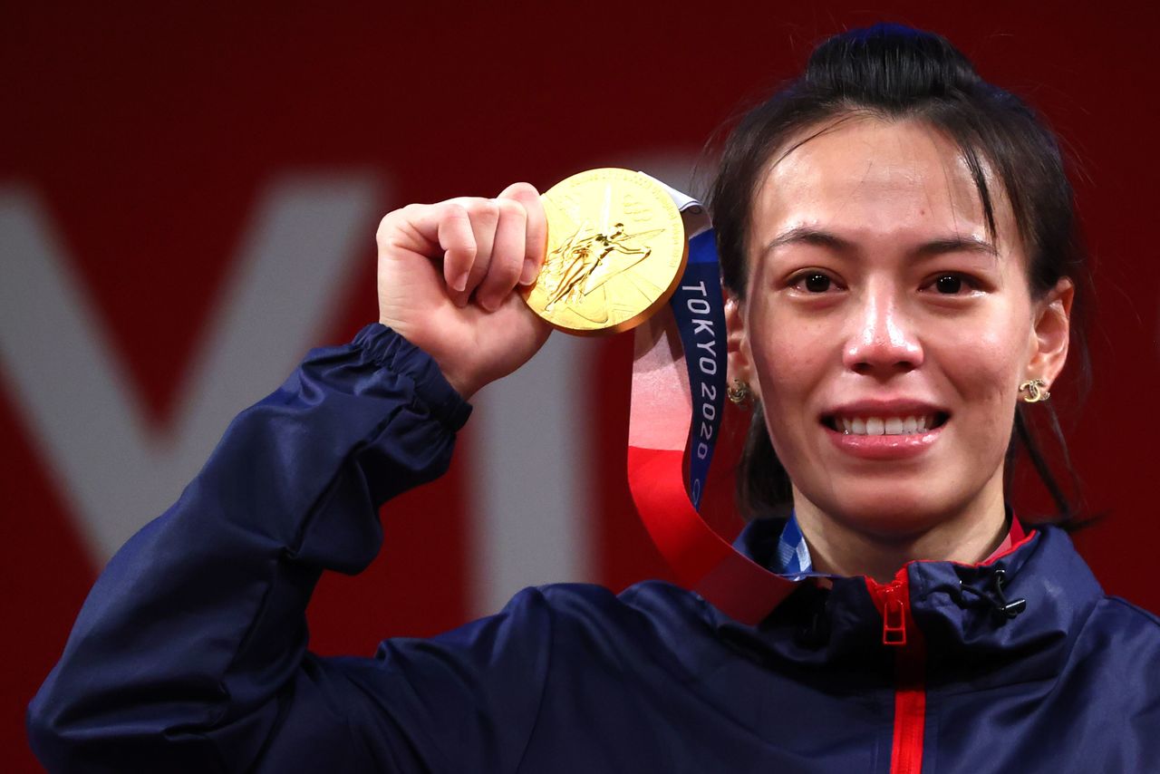 Tokyo 2020 Olympics - Weightlifting - Women's 59kg - Medal Ceremony - Tokyo International Forum, Tokyo, Japan - July 27, 2021. Gold medalist Kuo Hsing-Chun of Taiwan reacts. REUTERS/Edgard Garrido