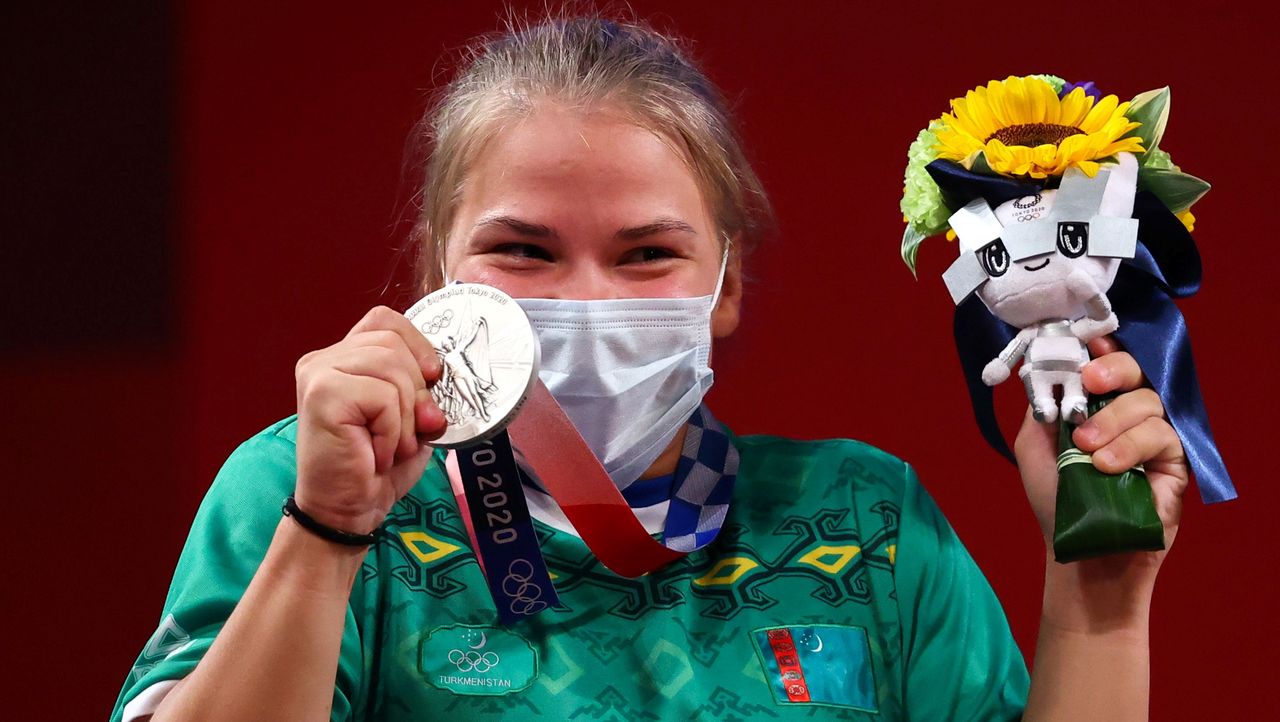 Tokyo 2020 Olympics - Weightlifting - Women's 59kg - Medal Ceremony - Tokyo International Forum, Tokyo, Japan - July 27, 2021. Silver medalist Polina Guryeva of Turkmenistan reacts. REUTERS/Edgard Garrido