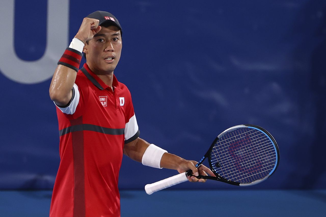 Tokyo 2020 Olympics - Tennis - Men's Singles - Round 2 - Ariake Tennis Park - Tokyo, Japan - July 27, 2021. Kei Nishikori of Japan celebrates after winning his second round match against Marcos Giron of the United States REUTERS/Edgar Su