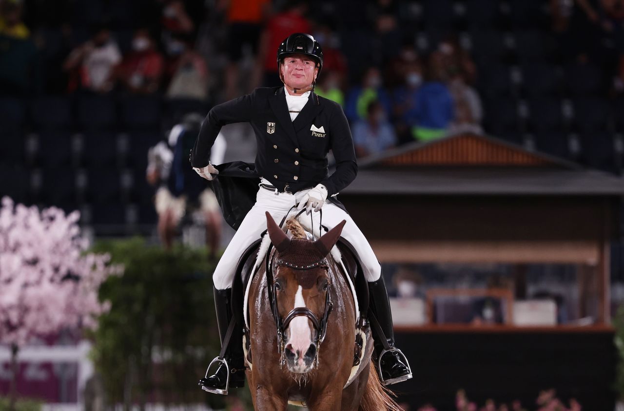 Tokyo 2020 Olympics - Equestrian - Dressage - Grand Prix Special - Team - Equestrian Park - Tokyo, Japan - July 27, 2021. Isabell Werth of Germany on her horse Bella Rose 2 reacts after competing. REUTERS/Alkis Konstantinidis