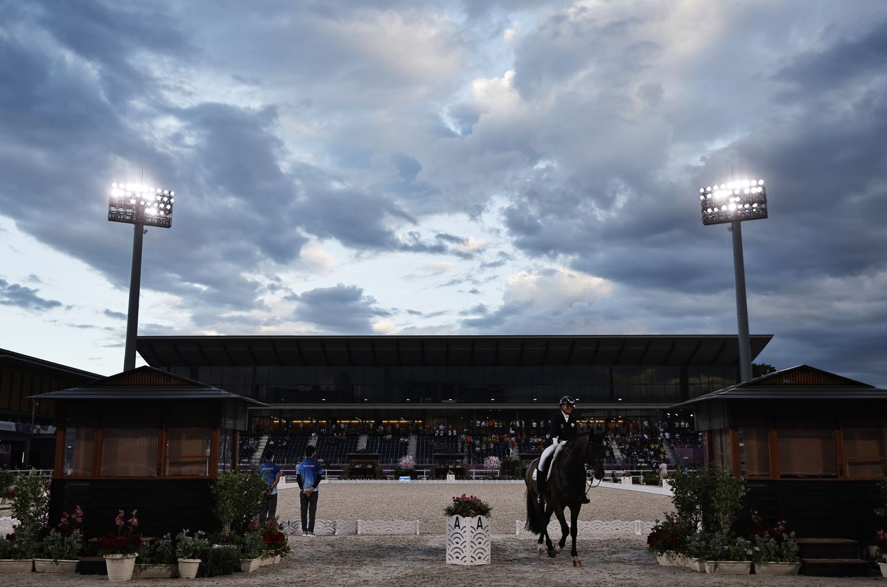 Tokyo 2020 Olympics - Equestrian - Dressage - Grand Prix Special - Team - Equestrian Park - Tokyo, Japan - July 27, 2021. Dorothee Schneider of Germany on her horse Showtime FRH leaves after competing. REUTERS/Alkis Konstantinidis
