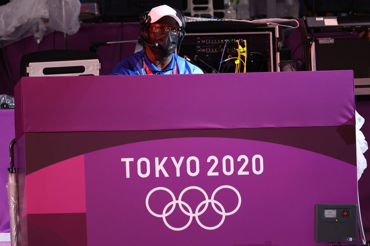 FILE PHOTO: Tokyo 2020 Olympics - Basketball 3x3 - Women - Quarterfinal - Japan v France - Aomi Urban Sports Park, Tokyo Japan - July 27, 2021. A Dj performs between matches. REUTERS/Andrew Boyers/File Photo