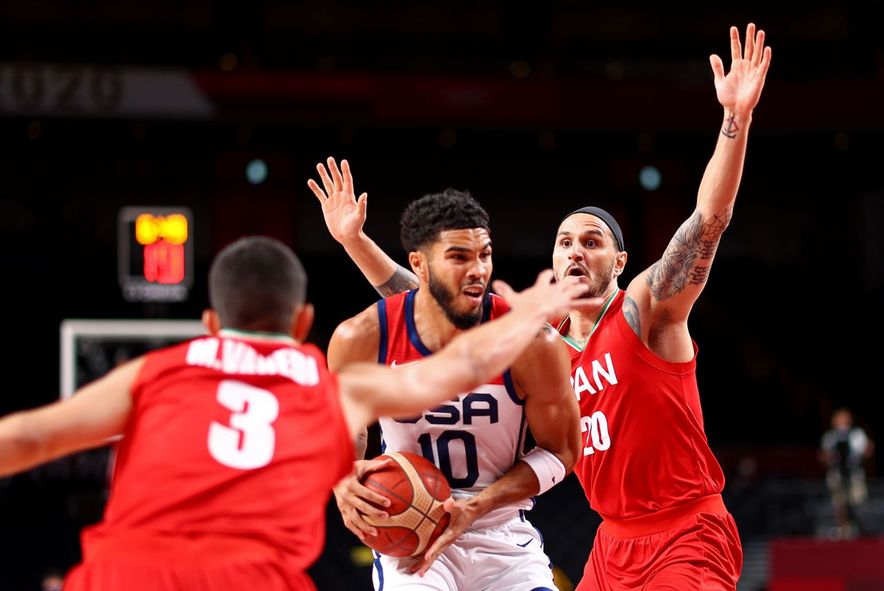 Tokyo 2020 Olympics - Basketball - Men - Group A - United States v Iran - Saitama Super Arena, Saitama, Japan - July 28, 2021. Jayson Tatum of the United States in action with Mike Rostampour of Iran REUTERS/Brian Snyder