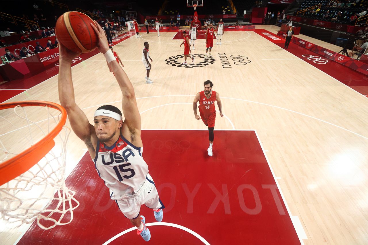 Tokyo 2020 Olympics - Basketball - Men - Group A - United States v Iran - Saitama Super Arena, Saitama, Japan - July 28, 2021. Devin Booker of the United States scores a basket Pool via REUTERS/Gregory Shamus