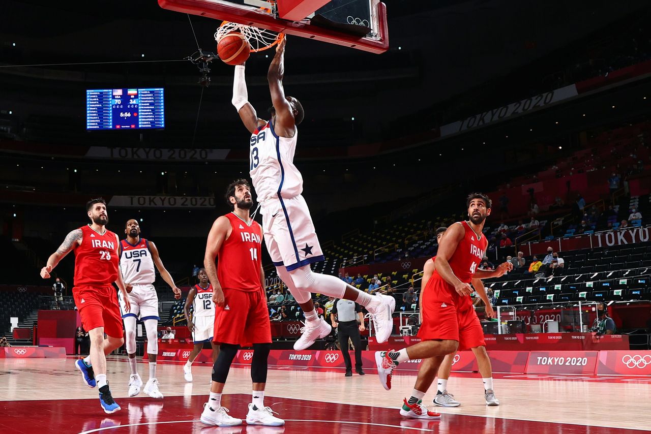 Tokyo 2020 Olympics - Basketball - Men - Group A - United States v Iran - Saitama Super Arena, Saitama, Japan - July 28, 2021. Edrice Adebayo of the United States scores a basket as Iran players look on REUTERS/Brian Snyder
