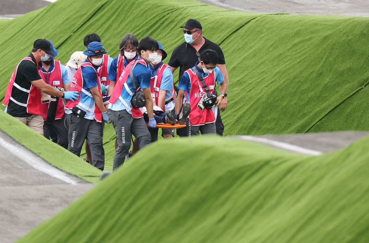 Tokyo 2020 Olympics - BMX Racing - Men's Individual - Semifinal - AUP - Ariake Urban Sports Park, Tokyo, Japan - July 30, 2021. Connor Fields of the United States receives medical attention. REUTERS/Christian Hartmann