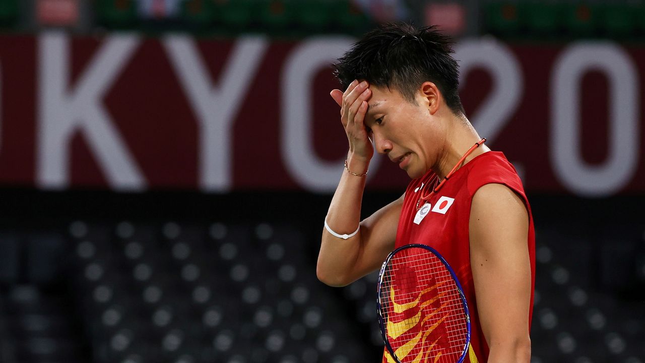 FILE PHOTO: Kento Momota of Japan reacts during the match against Heo Kwang-Hee of South Korea in the Tokyo 2020 Olympics. REUTERS/Leonhard Foeger/File Photo