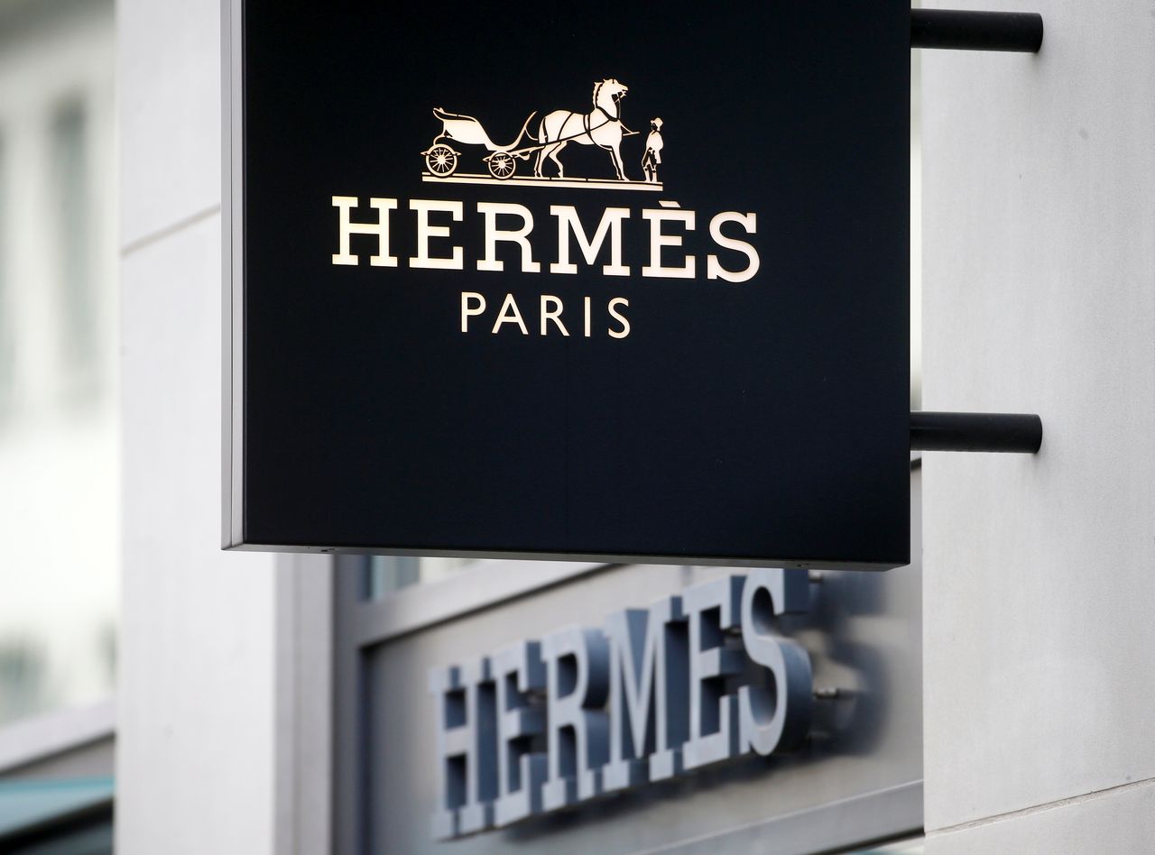 FILE PHOTO: The logo of French luxury group Hermes is seen at a store, as the spread of the coronavirus disease (COVID-19) continues, in Zurich, Switzerland February 17, 2021. REUTERS/Arnd Wiegmann