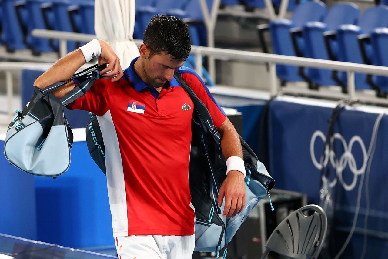 Tokyo 2020 Olympics - Tennis - Men's Singles - Semifinal - Ariake Tennis Park - Tokyo, Japan - July 30, 2021. Novak Djokovic of Serbia walks off after losing his semifinal match against Alexander Zverev of Germany. REUTERS/Mike Segar