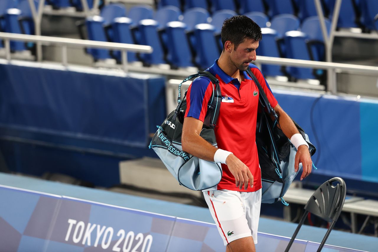 Tokyo 2020 Olympics - Tennis - Men's Singles - Semifinal - Ariake Tennis Park - Tokyo, Japan - July 30, 2021. Novak Djokovic of Serbia walks off after losing his semifinal match against Alexander Zverev of Germany REUTERS/Mike Segar