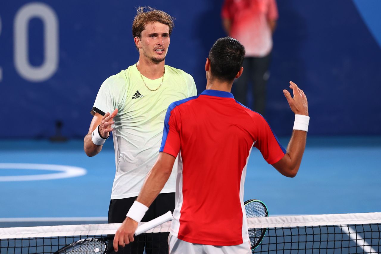 Tokyo 2020 Olympics - Tennis - Men's Singles - Semifinal - Ariake Tennis Park - Tokyo, Japan - July 30, 2021. Alexander Zverev of Germany shakes hands with Novak Djokovic of Serbia after winning his semifinal match REUTERS/Mike Segar