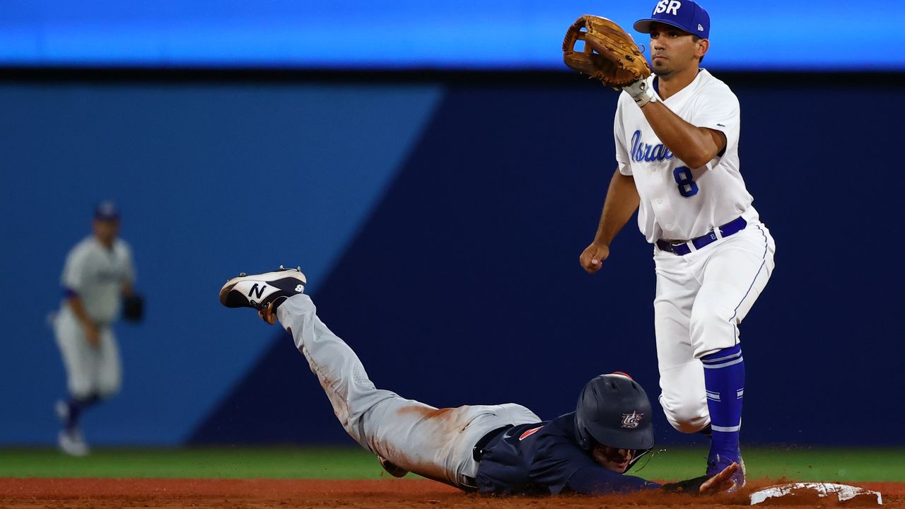 Tokyo 2020 Olympics - Baseball - Men - Opening Round - Group B - United States v Israel - Yokohama Baseball Stadium, Yokohama, Japan - July 30, 2021. Scott Burcham of Israel and Nick Allen of the United States in action. REUTERS/Jorge Silva