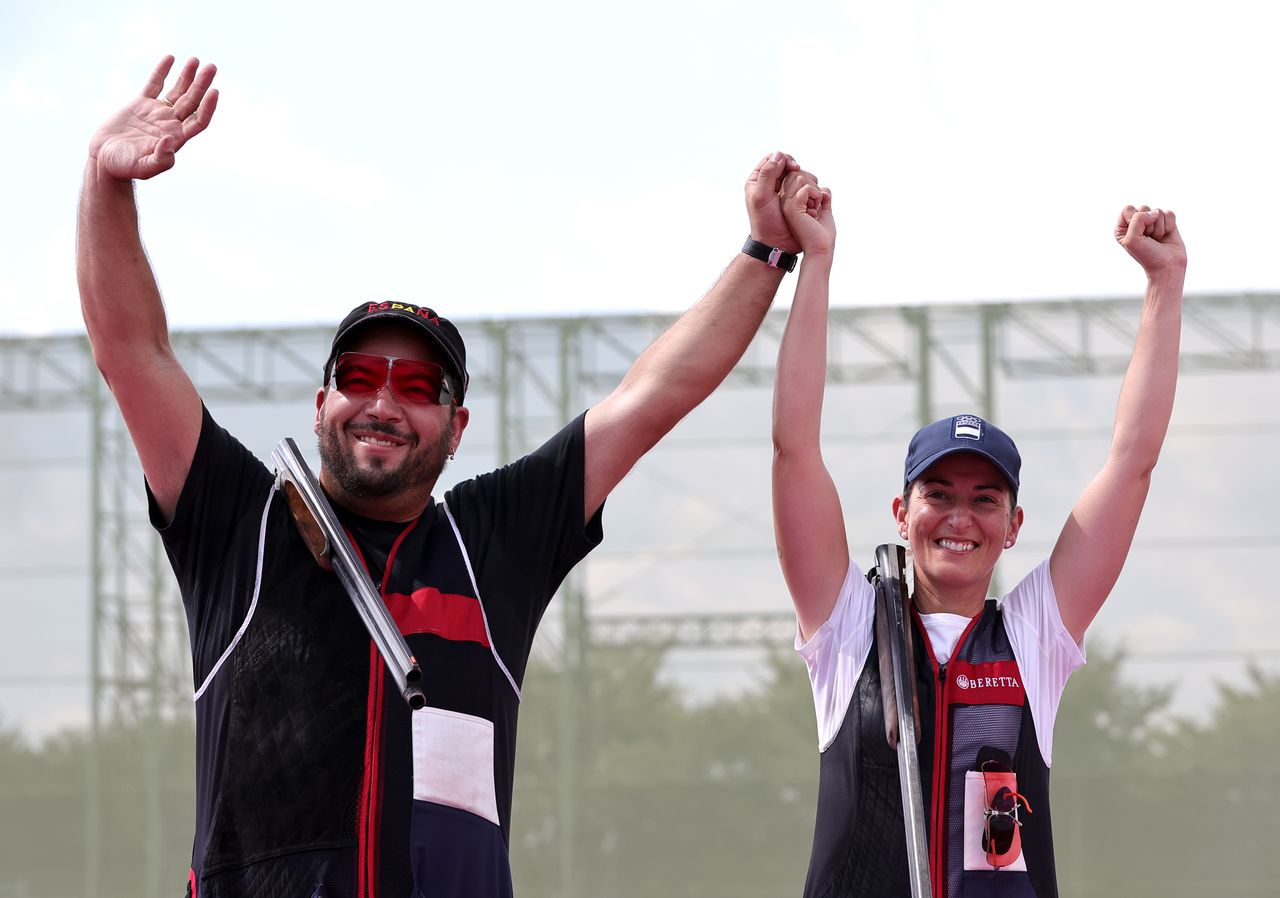 Tokyo 2020 Olympics - Shooting - Mixed Trap Team - Gold medal match - Asaka Shooting Range, Tokyo, Japan - July 31, 2021. Fatima Galvez of Spain and Alberto Fernandez of Spain celebrate after winning gold REUTERS/Ann Wang