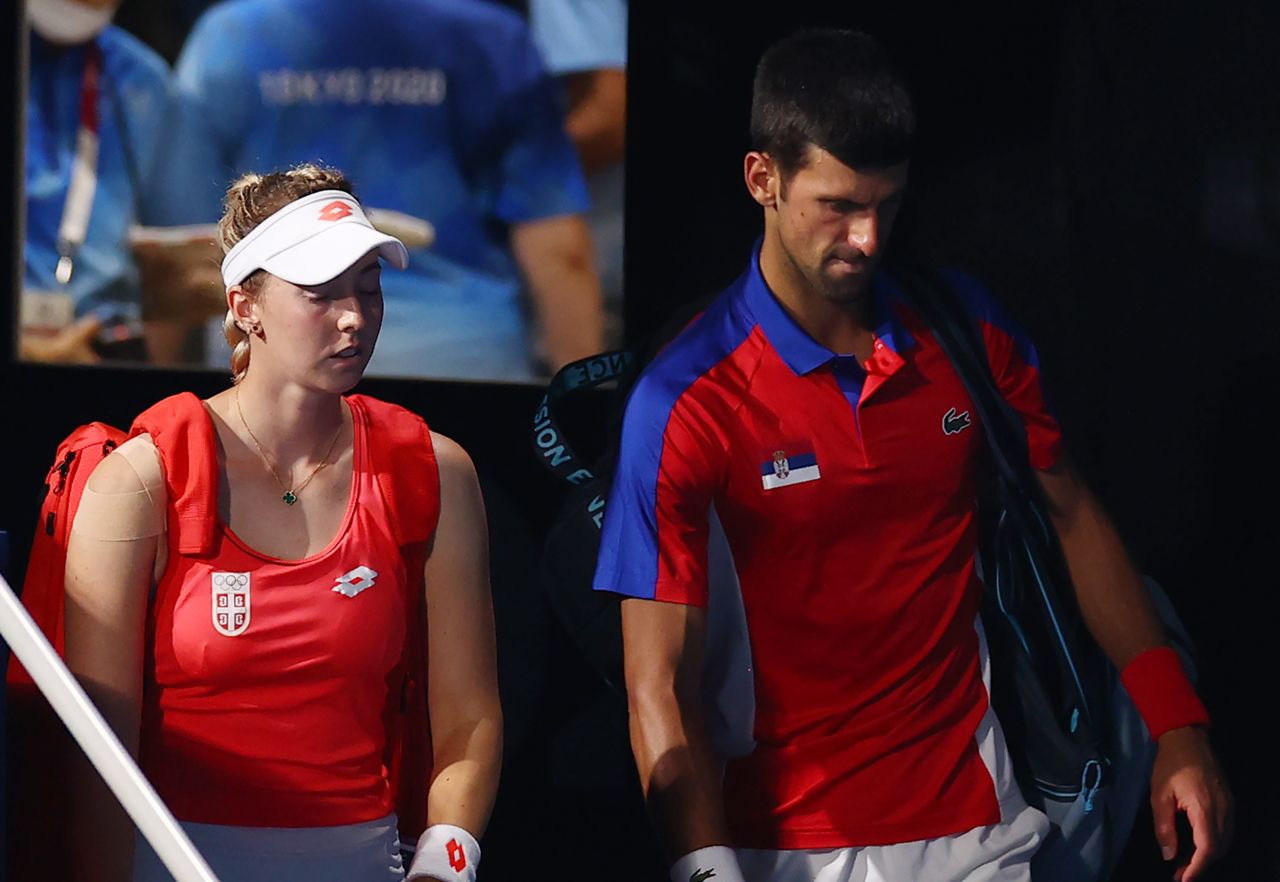 Tokyo 2020 Olympics - Tennis - Mixed Doubles - Semifinal - Ariake Tennis Park, Tokyo, Japan - July 30, 2021. Nina Stojanovic of Serbia and Novak Djokovic of Serbia arrive ahead of their semifinal match against Aslan Karatsev of the Russian Olympic Committee and Elena Vesnina of the Russian Olympic Committee REUTERS/Edgar Su