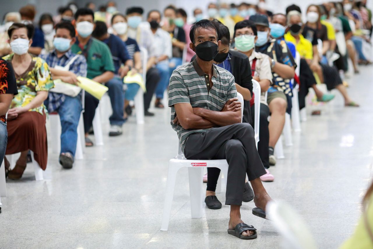 FILE PHOTO: People queue at the Central Vaccination Center as Thailand begins offering first doses of the AstraZeneca vaccine to at-risk groups amid the coronavirus (COVID-19) outbreak in Bangkok, Thailand, July 26, 2021. REUTERS/Soe Zeya Tun/File Photo