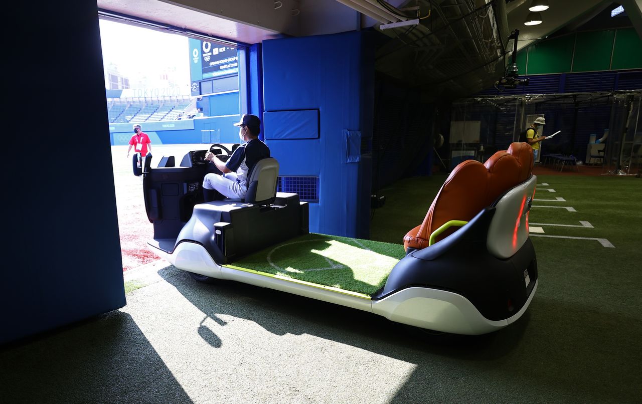 The bullpen cart is driven from the bullpen onto the field at Yokohama Baseball Stadium during the Tokyo 2020 Olympic Games, in Yokohama, Japan July 31, 2021. REUTERS/Jorge Silva