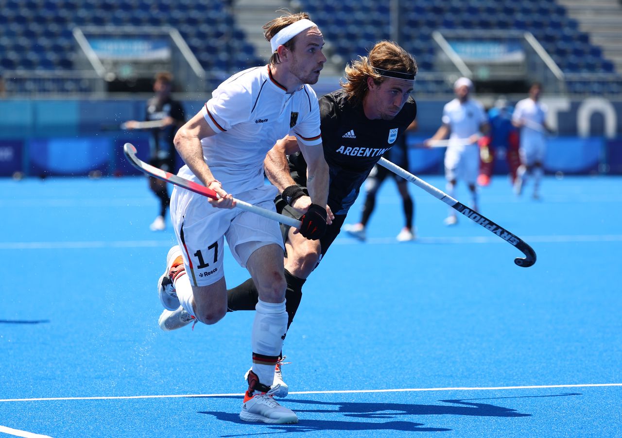 Tokyo 2020 Olympics - Hockey - Men - Quarterfinal - Germany v Argentina - Oi Hockey Stadium, Tokyo, Japan - August 1, 2021. Christopher Ruehr of Germany in action against Maico Casella of Argentina. REUTERS/Bernadett Szabo