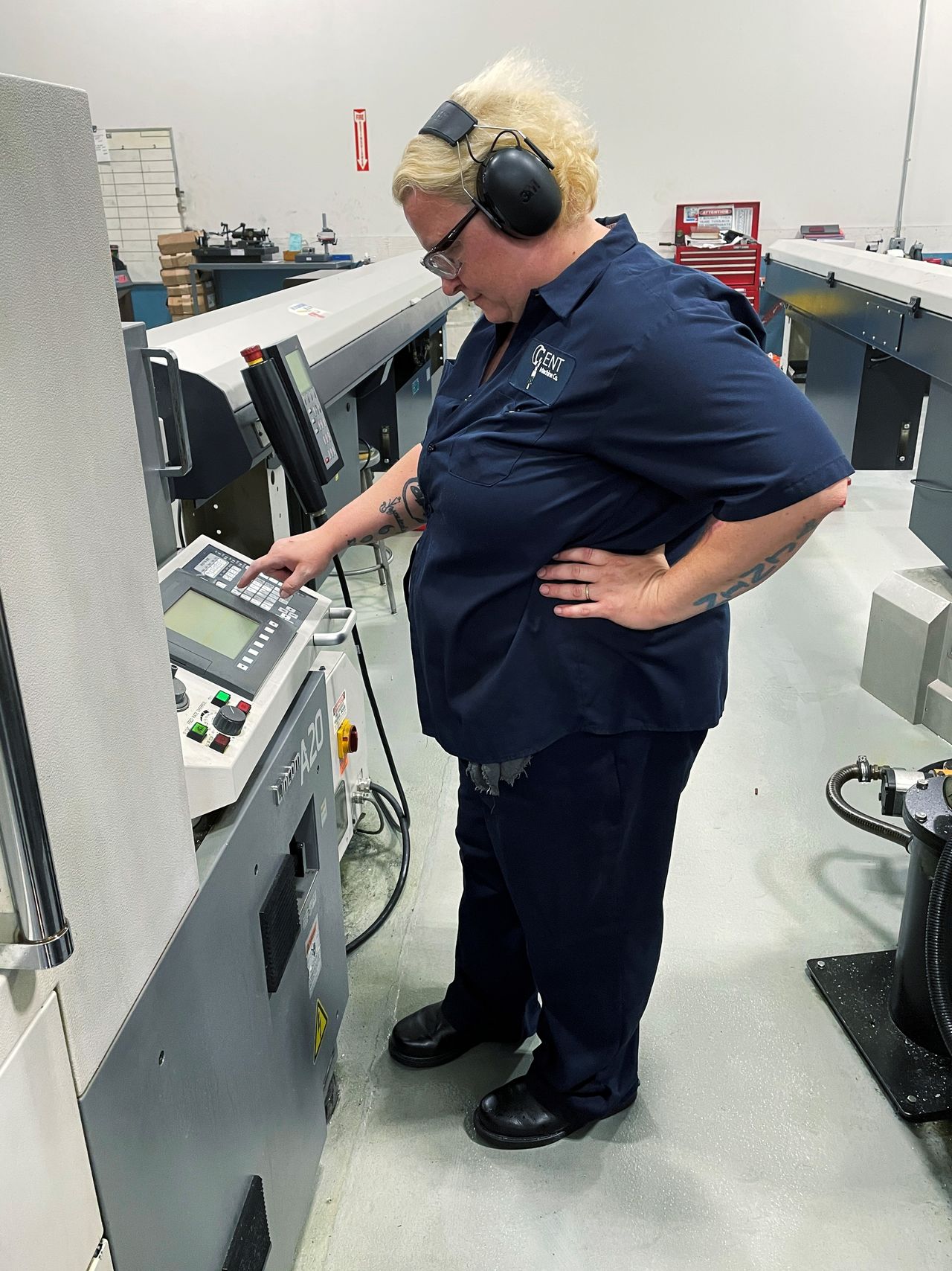A worker operates one of the metal cutting machines at Gent Machine Co.