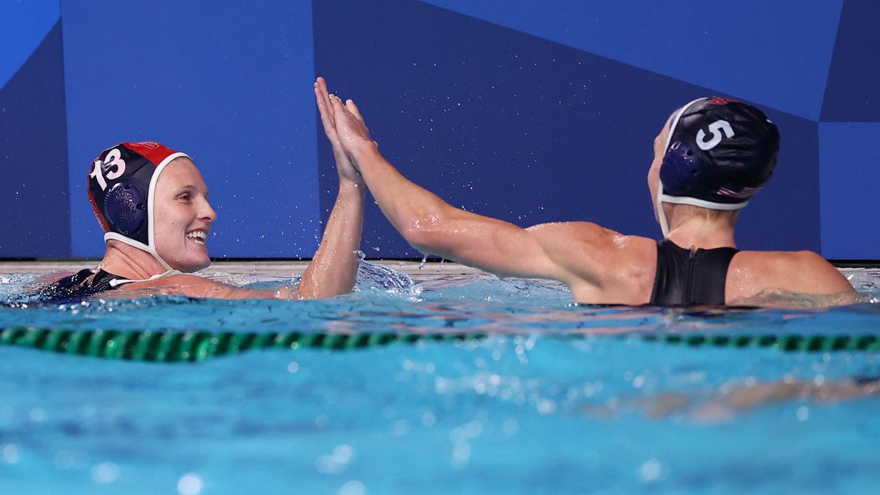 Tokyo 2020 Olympics - Water Polo - Women - Quarterfinal - Canada v United States - Tatsumi Water Polo Centre, Tokyo, Japan - August 3, 2021. Amanda Longan of the United States and Paige Hauschild of the United States celebrate after game. REUTERS/Gonzalo Fuentes