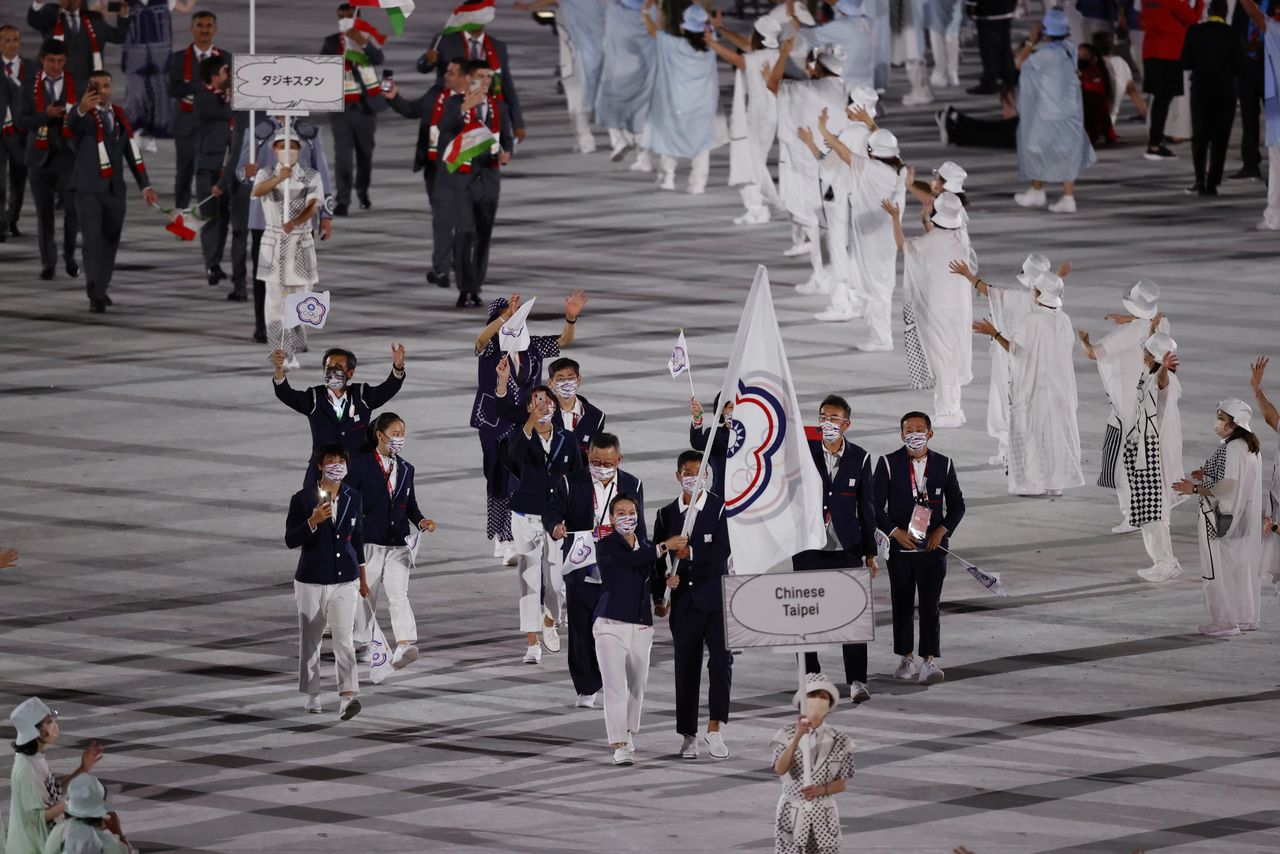 FILE PHOTO: Tokyo 2020 Olympics - The Tokyo 2020 Olympics Opening Ceremony - Olympic Stadium, Tokyo, Japan - July 23, 2021. Flagbearer Lu Yen-hsun of Chinese Taipei lead their contingent in the athletes parade during the opening ceremony REUTERS/Phil Noble