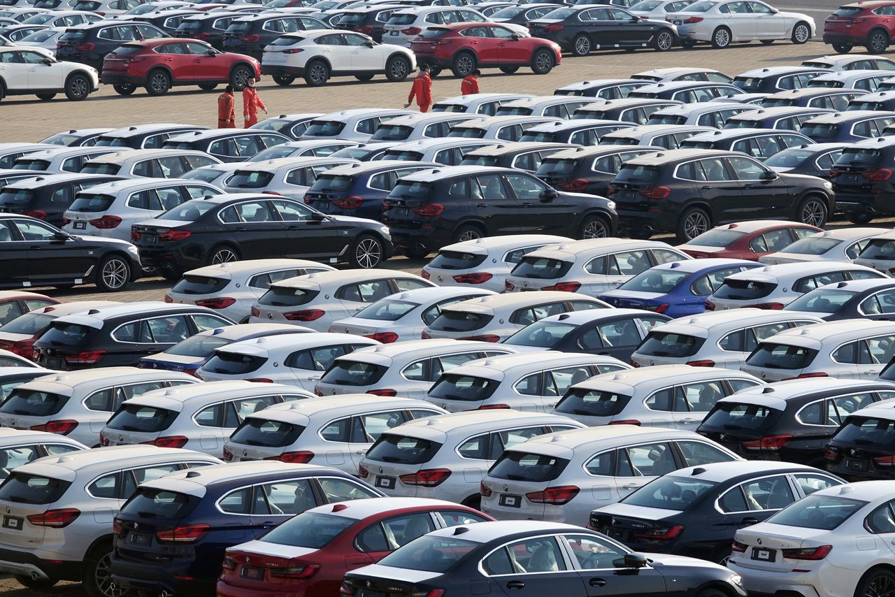 Newly manufactured cars are seen at a port in Dalian, Liaoning province, China April 10, 2020. China Daily via REUTERS/File Photo