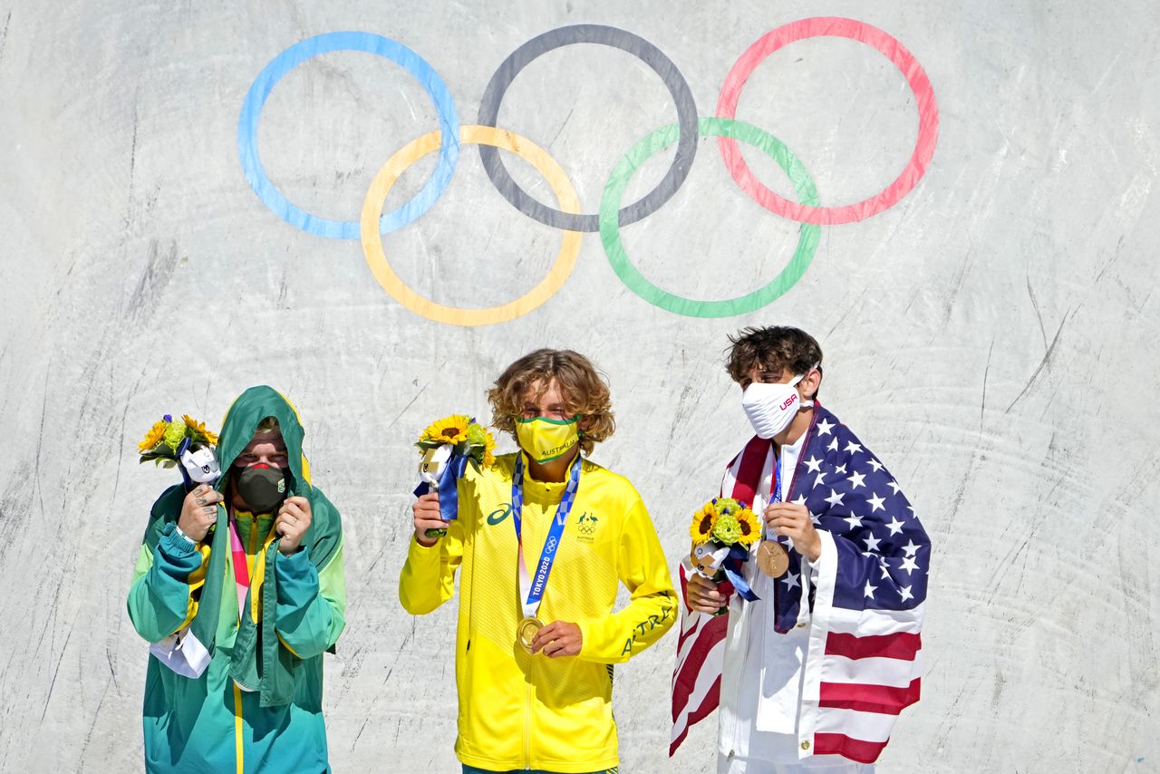 Aug 5, 2021; Tokyo, Japan; Keegan Palmer (AUS) celebrates winning the gold medal, Pedro Barros (BRA) celebrates winning the silver medal and Cory Juneau (USA) celebrates winning the bronze medal in the men