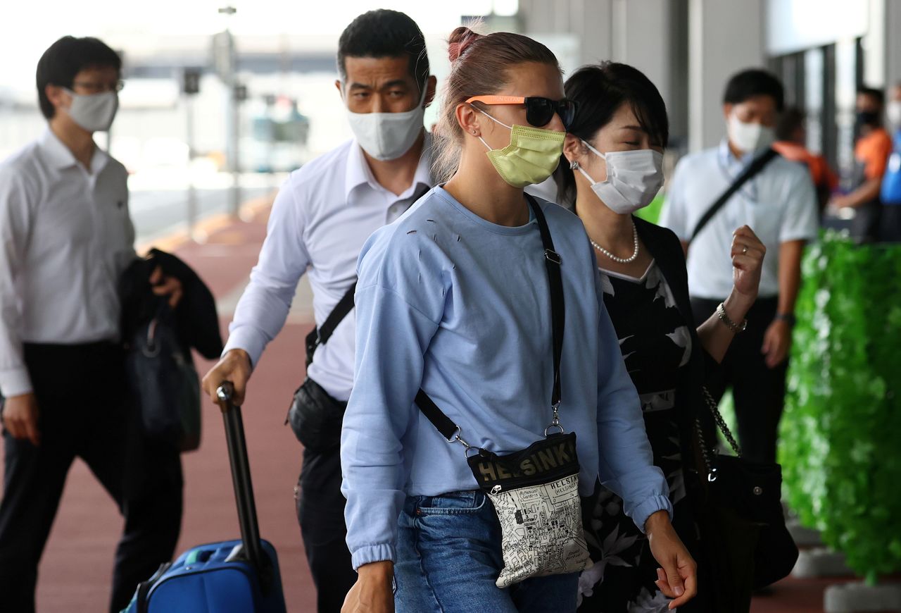Belarusian Sprinter Krystsina Tsimanouskaya who took refuge in the Polish embassy in Tokyo, arrives at Narita International Airport to leave for Vienna, in Narita, east of Tokyo, Japan August 4, 2021. REUTERS/Issei Kato