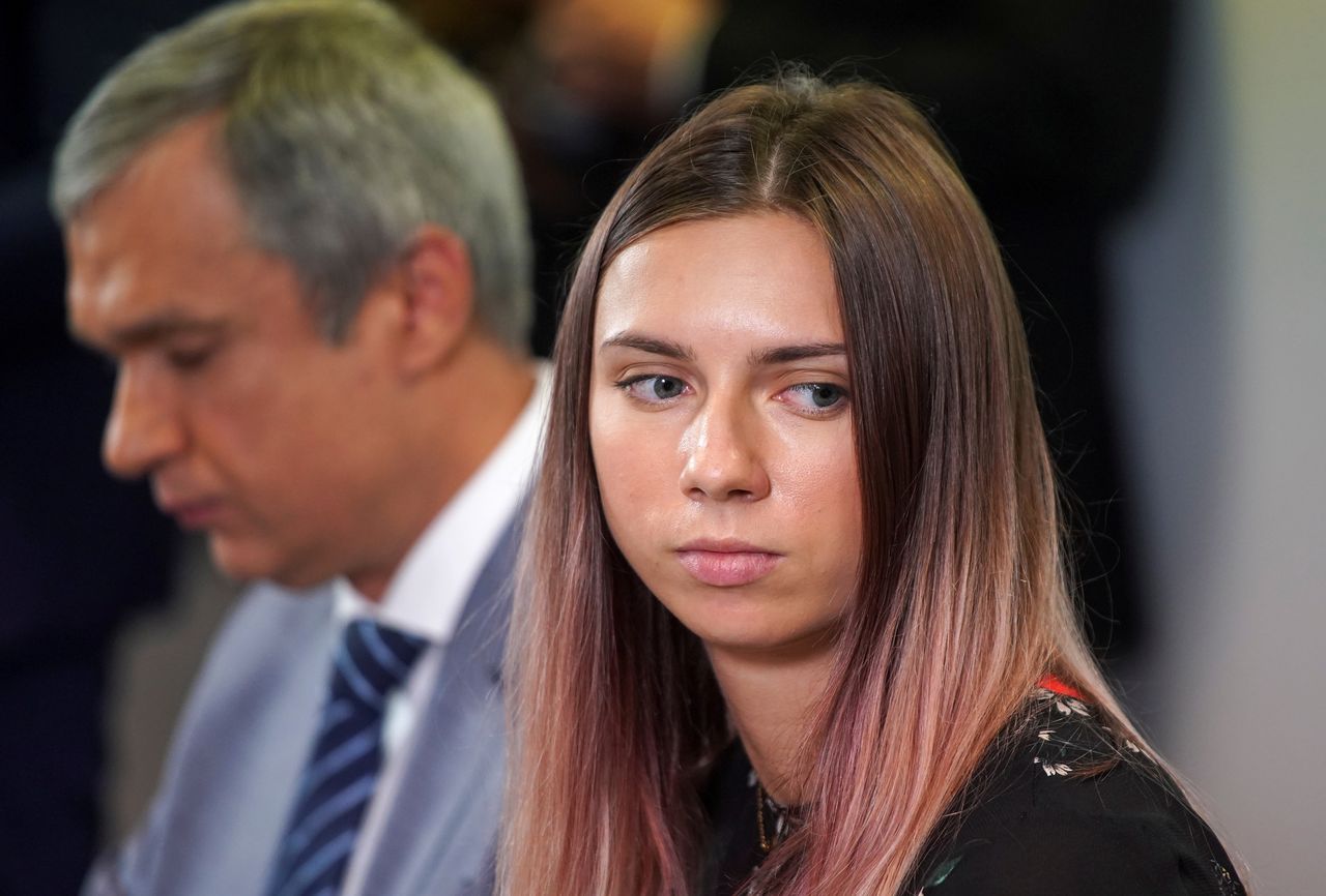 Belarusian sprinter Krystsina Tsimanouskaya, who left the Olympic Games in Tokyo and seeks asylum in Poland, and Belarusian opposition politician Pavel Latushka attend a news conference in Warsaw, Poland August 5, 2021. REUTERS/Darek Golik