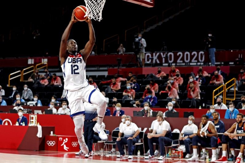 Aug 7, 2021; Saitama, Japan; United States guard Jrue Holiday (12) dunks the ball against France in the men