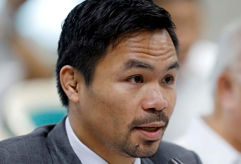 FILE PHOTO: Philippine Senator and boxer Manny Pacquiao speaks during the Congressional confirmation hearing of Environment Secretary Regina Lopez at the Senate in Manila, Philippines May 2, 2017. REUTERS/Erik De Castro