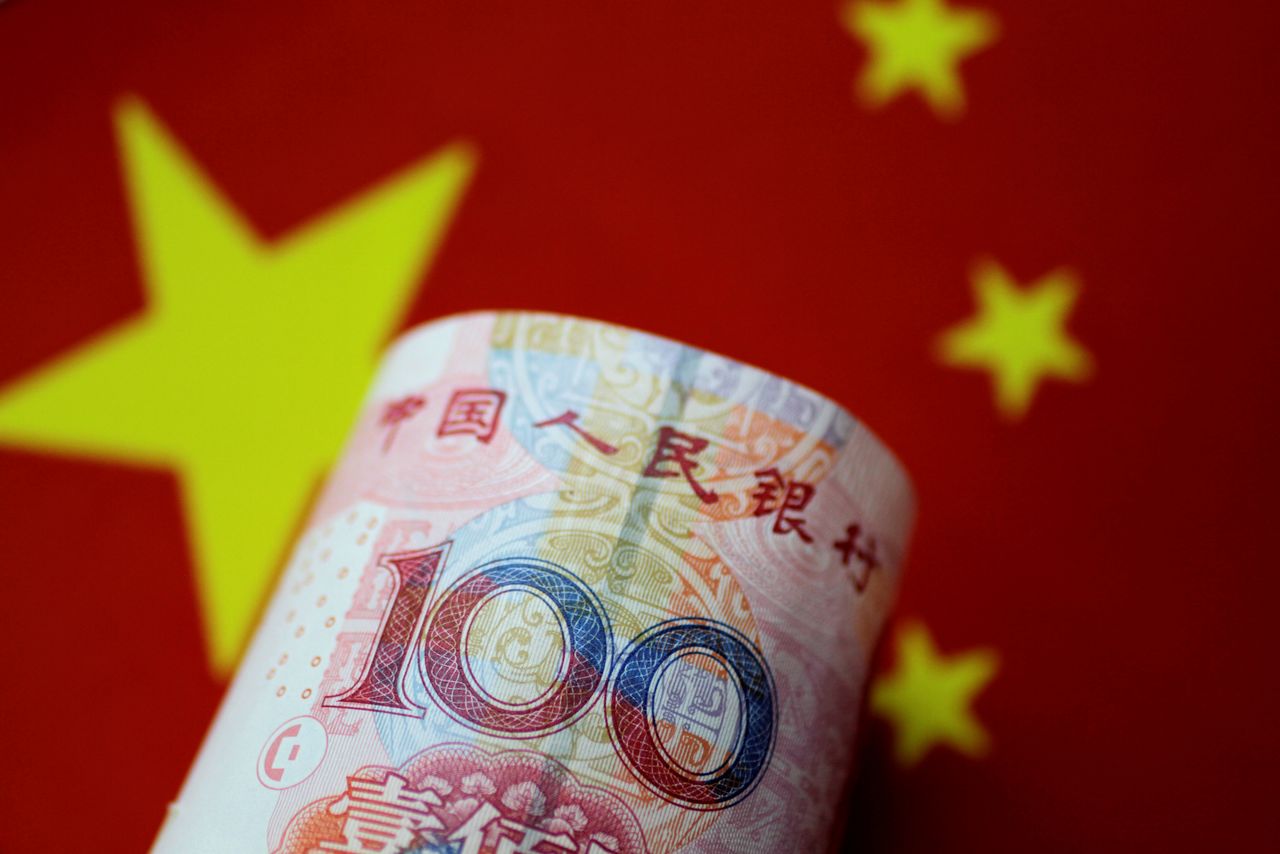 FILE PHOTO: A China yuan note is seen in this illustration photo May 31, 2017.  REUTERS/Thomas White/Illustration