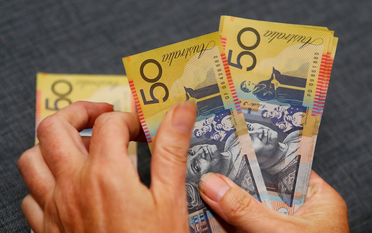 FILE PHOTO: Australian dollars are seen in an illustration photo February 8, 2018. REUTERS/Daniel Munoz