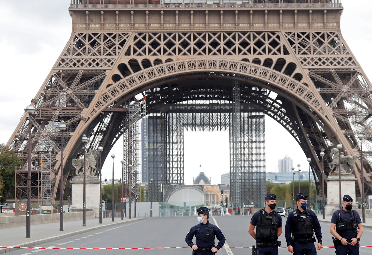 French police secure the area near the Eiffel Tower after the French tourism landmark was evacuated following a bomb alert in Paris, France, September 23, 2020. REUTERS/Charles Platiau