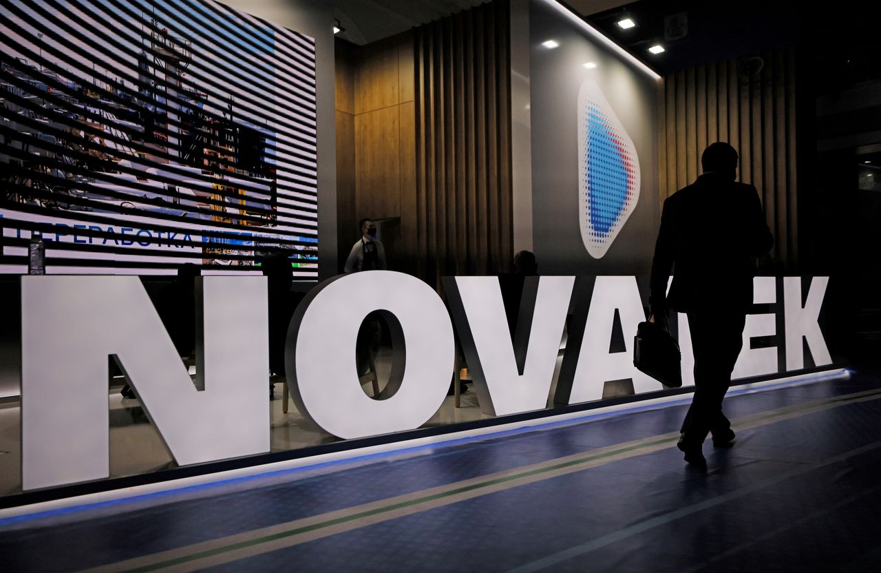A participant walks past a stand of Russian gas producer Novatek during the Russian Energy Week International Forum in Moscow, Russia October 13, 2021. REUTERS/Maxim Shemetov