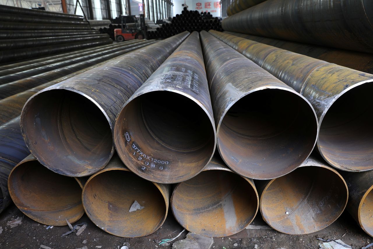 Steel pipes are seen stacked at an industrial park in Shenyang, Liaoning province, China September 30, 2021. REUTERS/Tingshu Wang