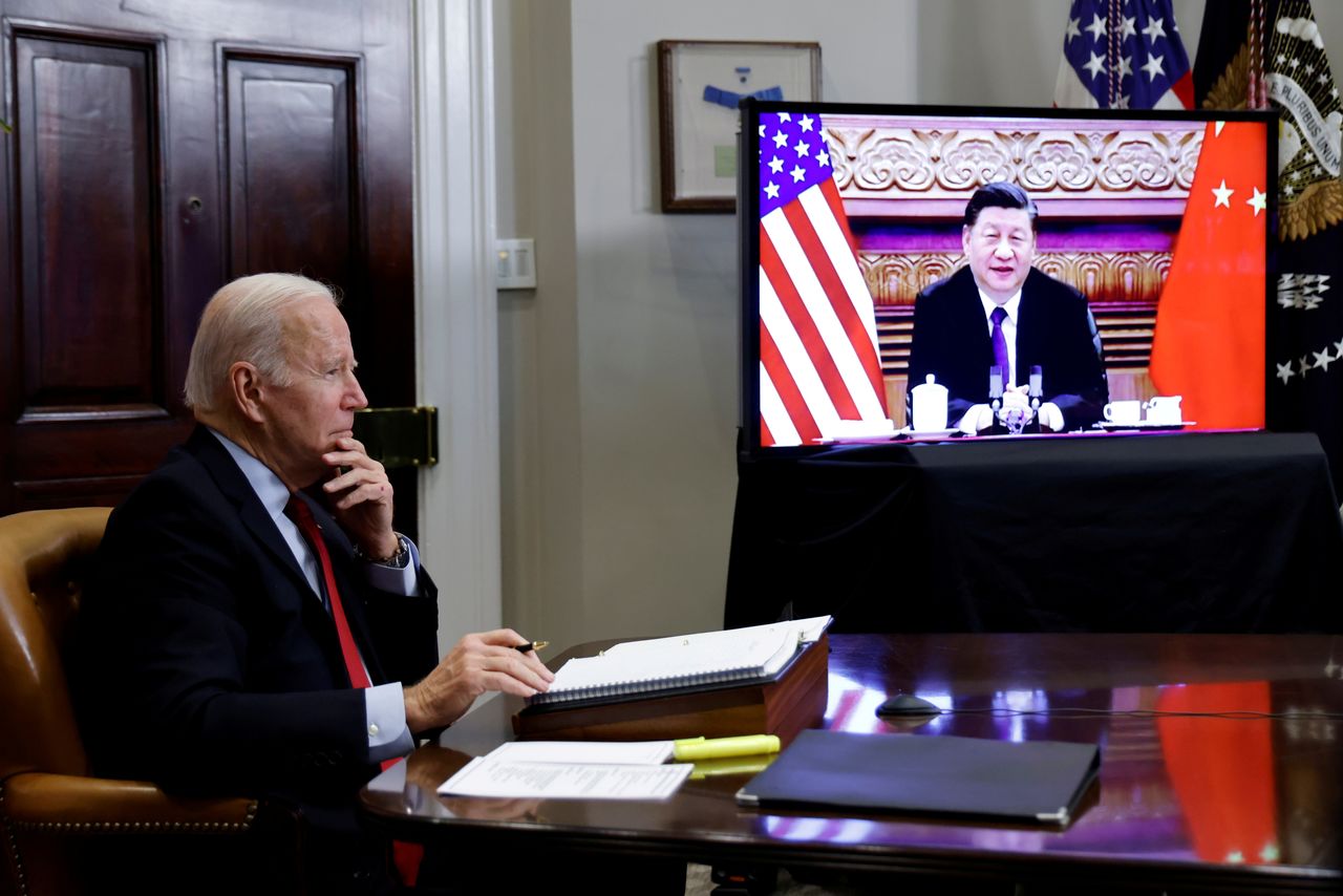 FILE PHOTO: U.S. President Joe Biden speaks virtually with Chinese leader Xi Jinping from the White House in Washington, U.S. November 15, 2021.  REUTERS/Jonathan Ernst/File Photo