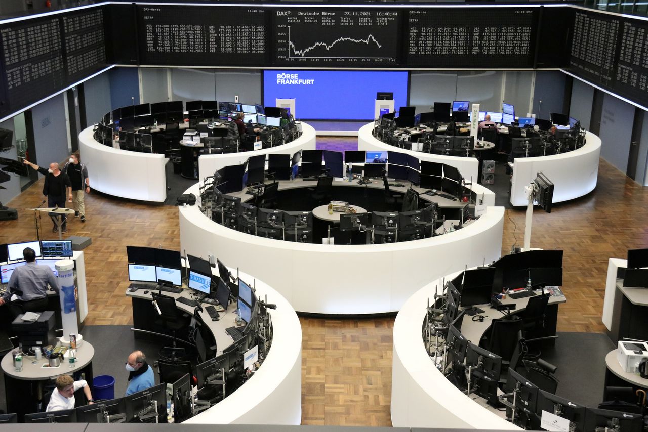 FILE PHOTO: The German share price index DAX graph is pictured at the stock exchange in Frankfurt, Germany, November 23, 2021. REUTERS/Staff