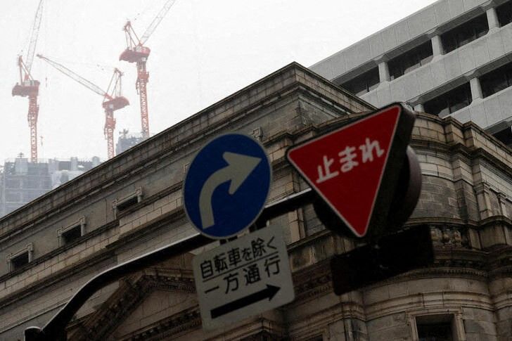 Traffic signs are seen in front of the headquarters of Bank of Japan amid the coronavirus disease (COVID-19) outbreak in Tokyo, Japan, May 22, 2020.REUTERS/Kim Kyung-Hoon