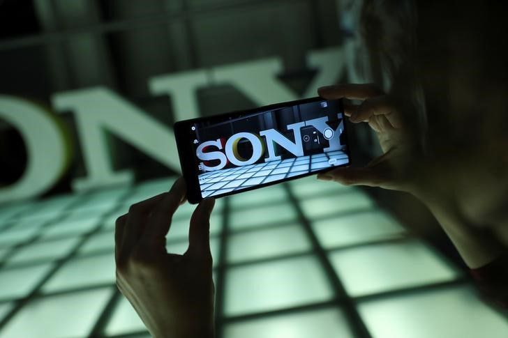 An employee takes a photo on a new Sony Xperia 10 Plus in this posed photograph at a pre-launch event at the Sony offices in London, Britain February 14, 2019. Picture taken February 14, 2019. REUTERS/Simon Dawson