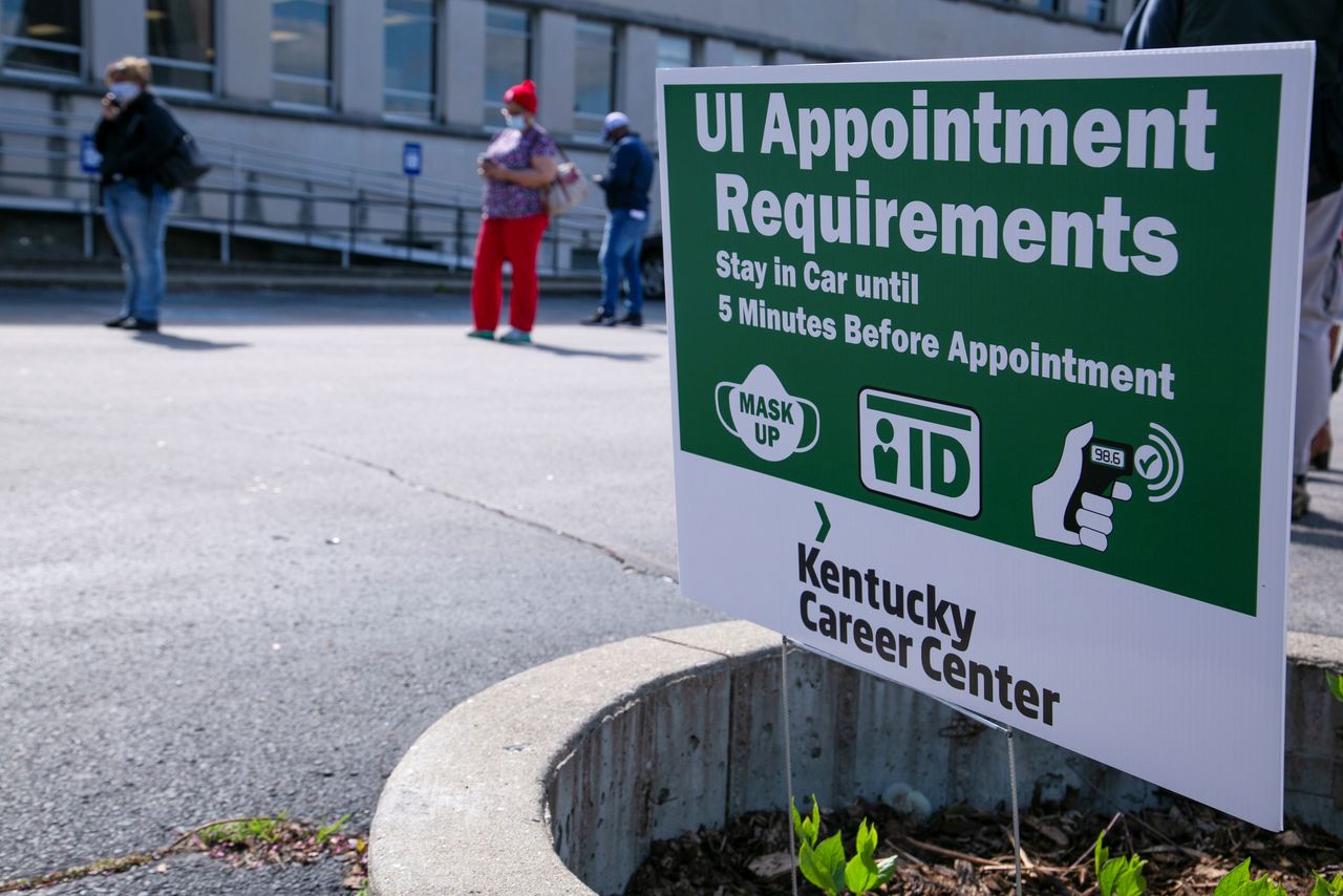 People wait in line as Kentucky Labor Cabinet reopens 13 Regional Career Centers for in-person unemployment insurance services, in Louisville, Kentucky, U.S., April 15, 2021. REUTERS/Amira Karaoud