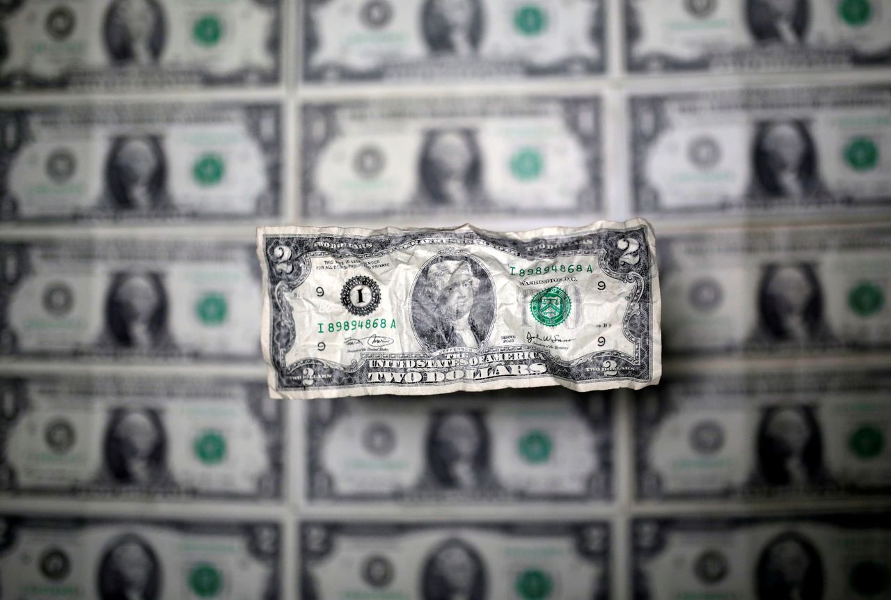 U.S. dollar banknote is seen in this picture illustration taken May 3, 2018. REUTERS/Dado Ruvic/Illustration