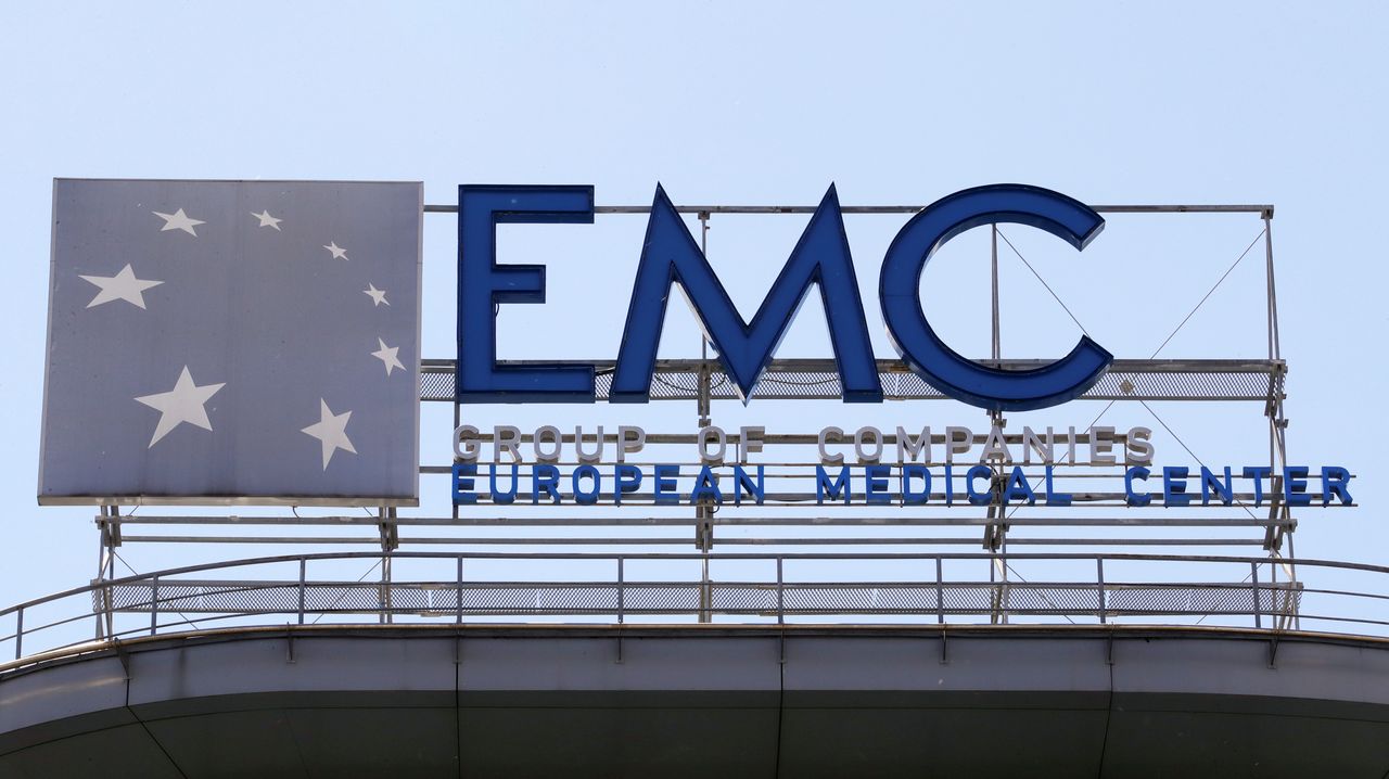 A board with the logo of Russian private health clinic operator European Medical Centre (EMC) is on display on the roof of a building in Moscow, Russia May 31, 2018. REUTERS/Tatyana Makeyeva