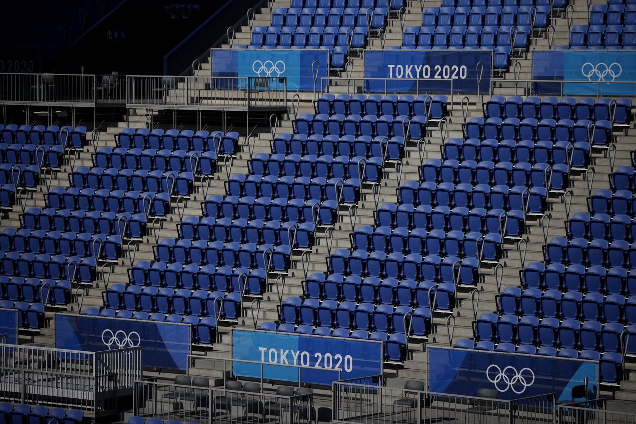 Tokyo 2020 Olympics - Tennis Training - Ariake Tennis Park, Tokyo, Japan - July 19, 2021 General view of Olympics signage and seats inside centre court at the Ariake Tennis Park REUTERS/Hannah Mckay